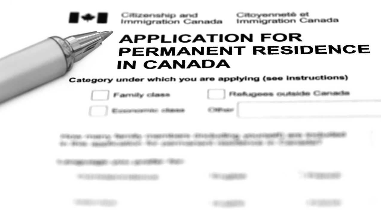 visa-application-form-filling-with-silver-ballpoint1